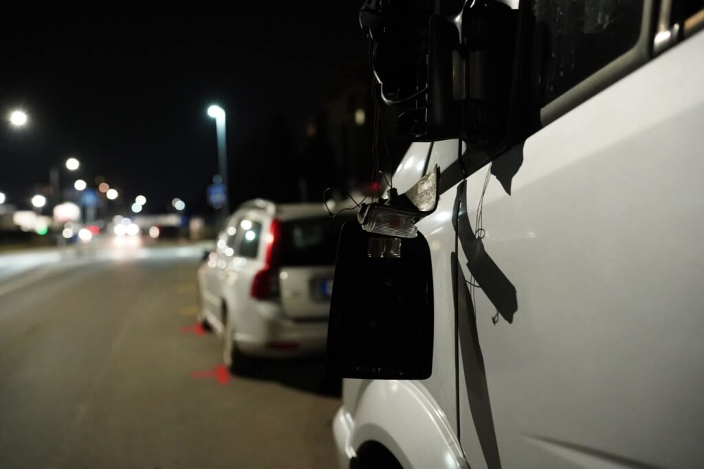 Close-up of commercial truck mirror damage for forensic evidence analysis