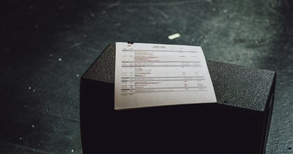 white paper document on black table