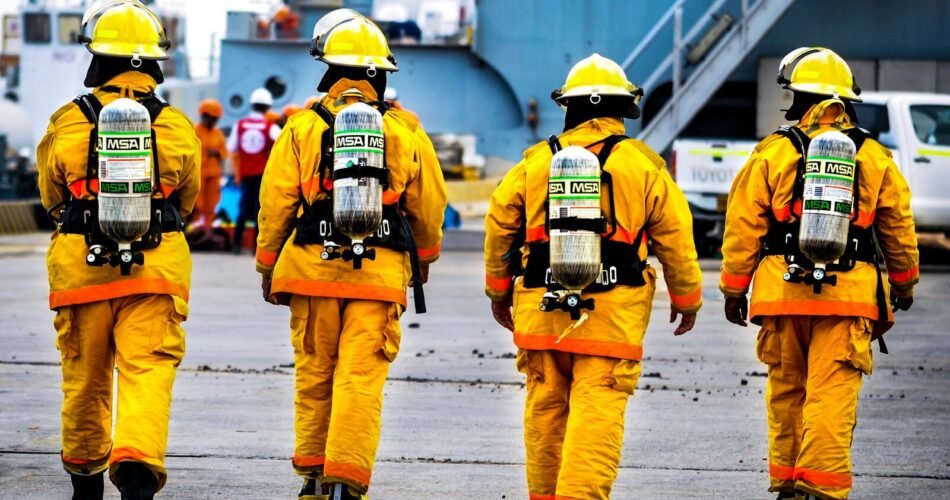 four yellow fire fighters